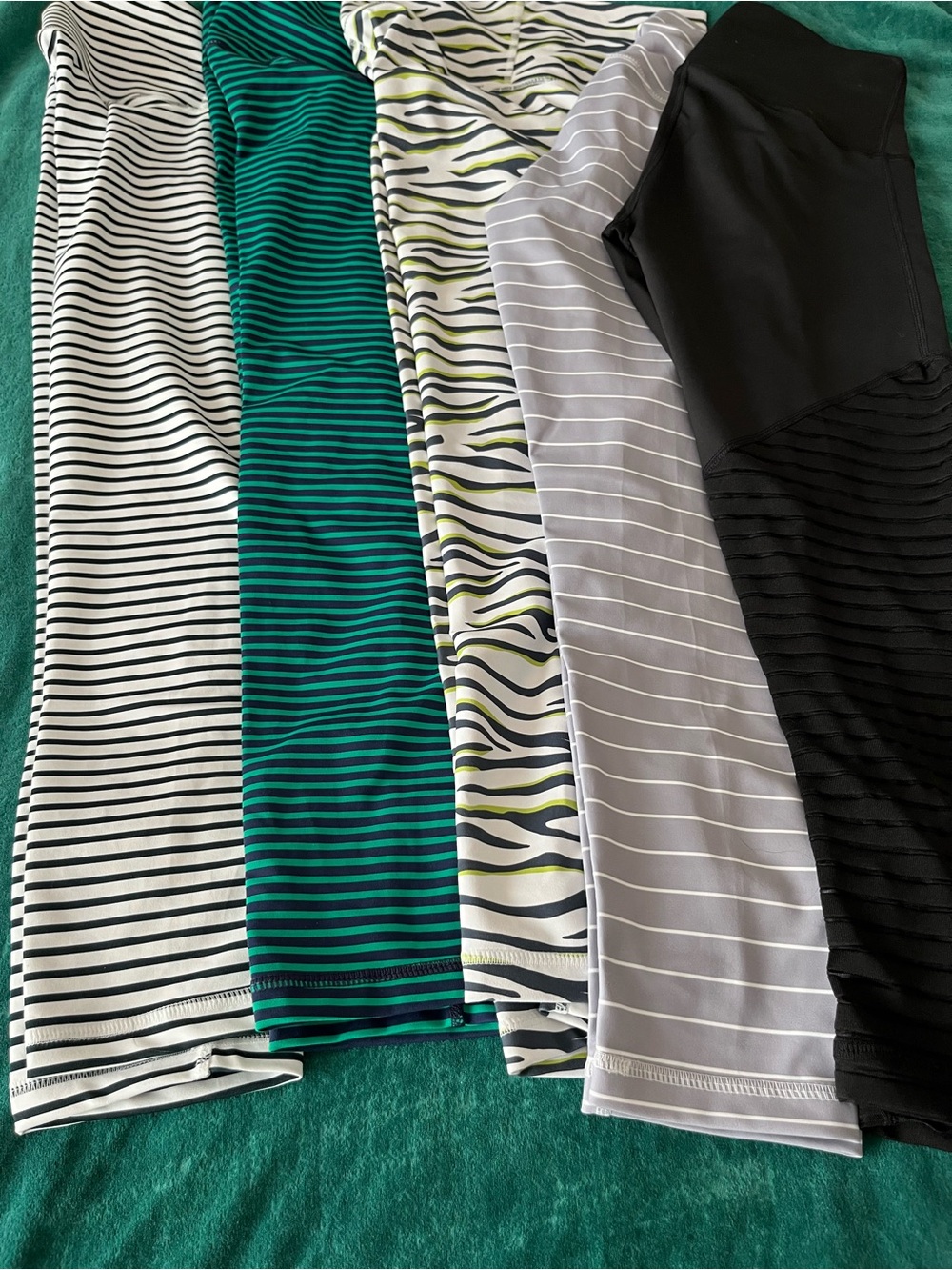 DYI brand 5 pairs of 3/4 length leggings. Striped and Animal Print Leggings